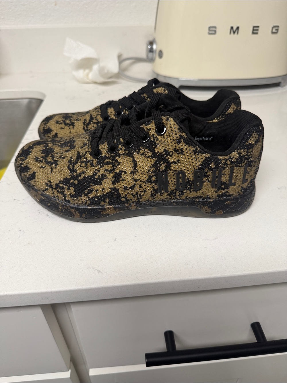 NOBULL Kids Black and Gold Speckle Sneakers